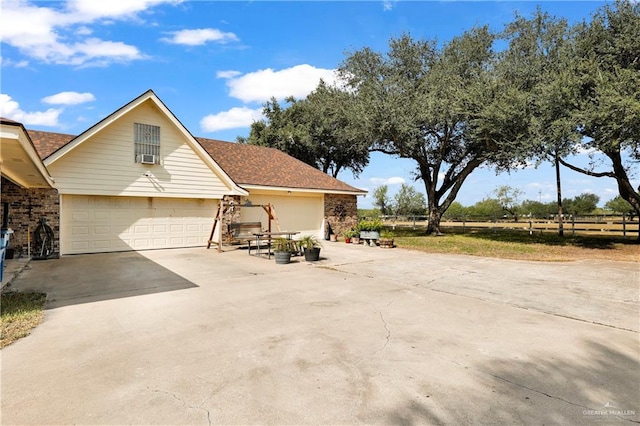 view of side of home with a garage