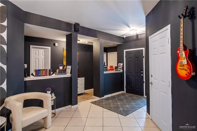 foyer with light tile patterned floors