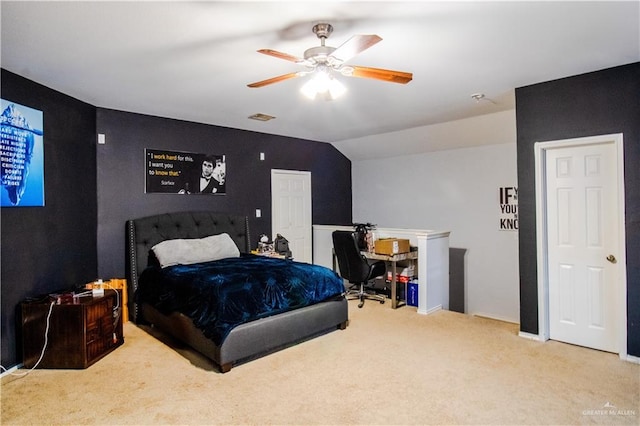 carpeted bedroom featuring ceiling fan and lofted ceiling