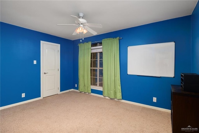 unfurnished bedroom featuring carpet and ceiling fan