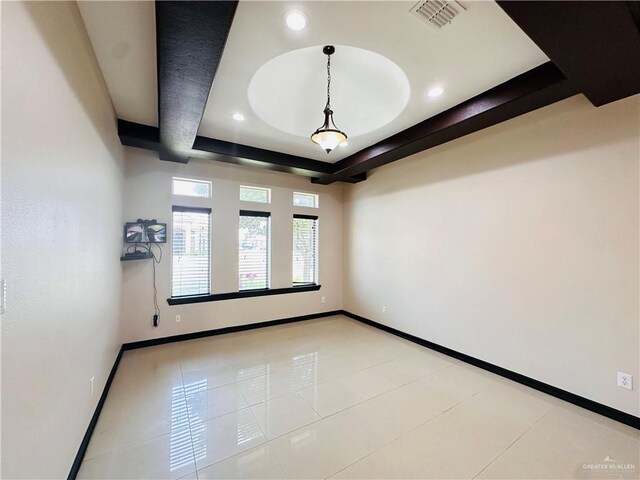 3106 Salvador Ave, Edinburg, TX 78539 - empty room featuring a tray ceiling, baseboards, recessed lighting, and light tile patterned floors