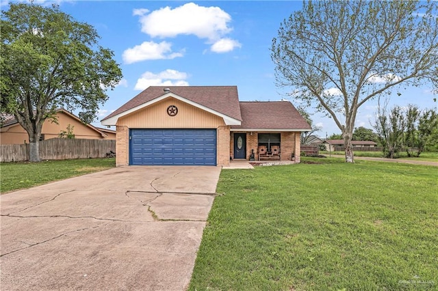 single story home featuring a garage and a front lawn