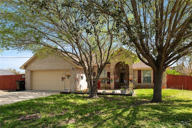 ranch-style house featuring fence, driveway, an attached garage, a front lawn, and brick siding