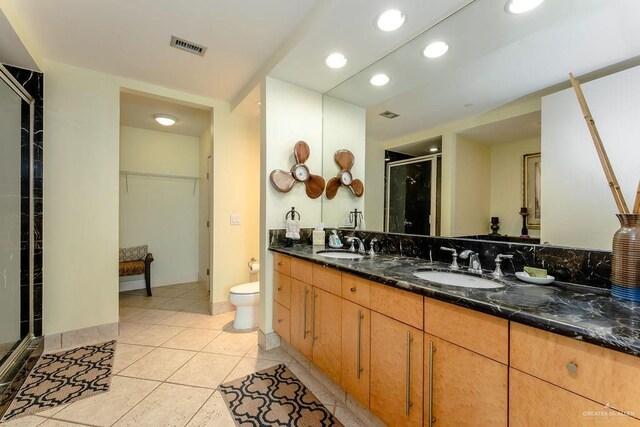310 Padre Blvd Unit 2306, South Padre Island, TX 78597 - full bathroom with a shower stall, double vanity, a spacious closet, tile patterned floors, and recessed lighting