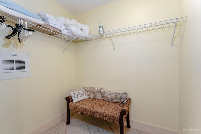 spacious closet with light tile patterned flooring