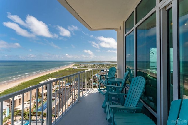 balcony with a view of the beach and a water view