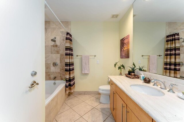 full bathroom with toilet, shower / bath combo, vanity, and tile patterned floors