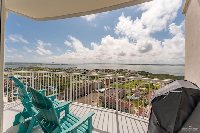 balcony with a grill and a water view