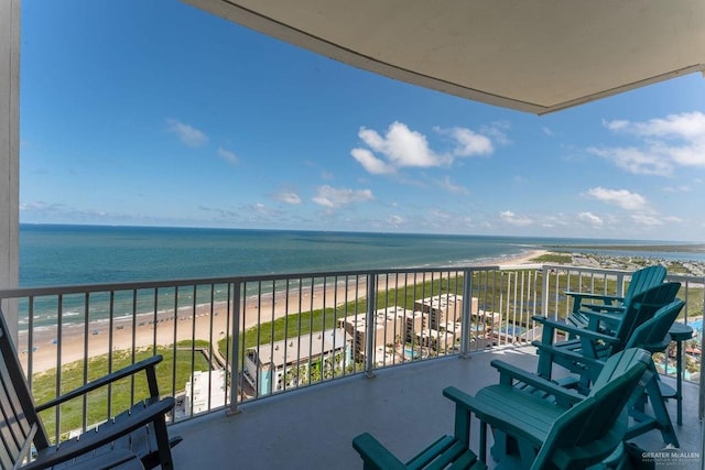 balcony with a beach view and a water view