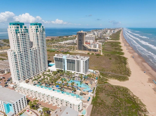 drone / aerial view with a water view and a view of the beach