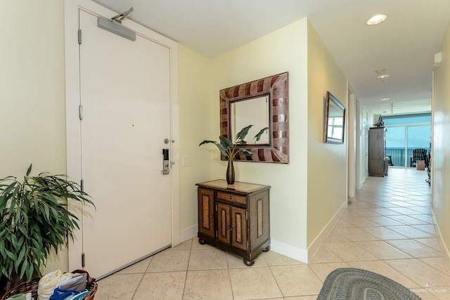 hallway with light tile patterned floors