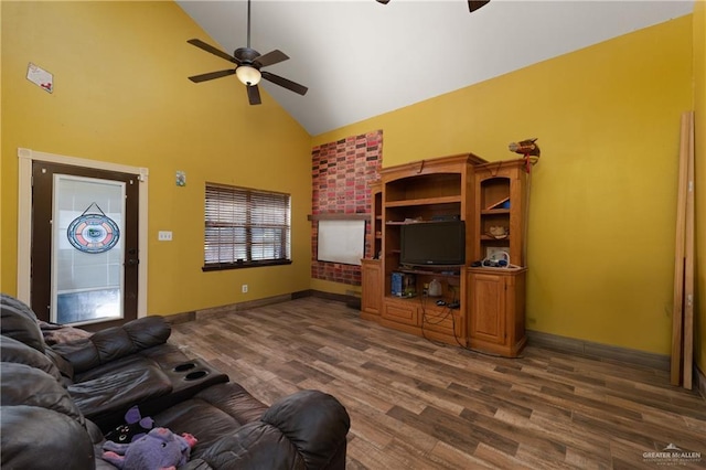 living room with high vaulted ceiling, dark wood-style flooring, baseboards, and a ceiling fan