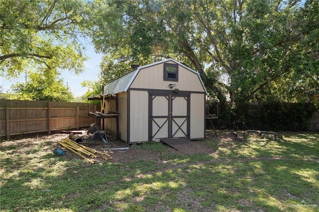 view of shed featuring a fenced backyard