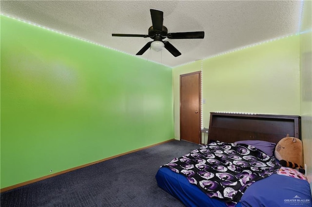 carpeted bedroom with a textured ceiling, ceiling fan, and baseboards