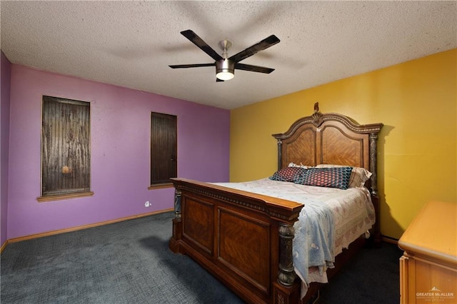bedroom featuring dark carpet, a textured ceiling, ceiling fan, and baseboards
