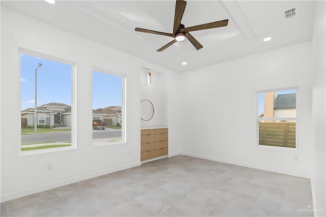 unfurnished room with ceiling fan