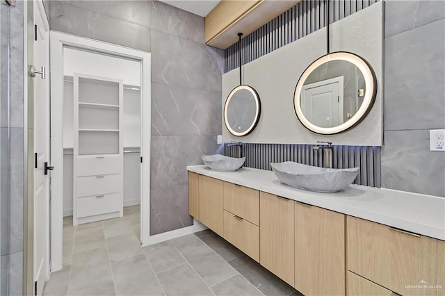 bathroom with vanity, tile walls, and tile patterned floors