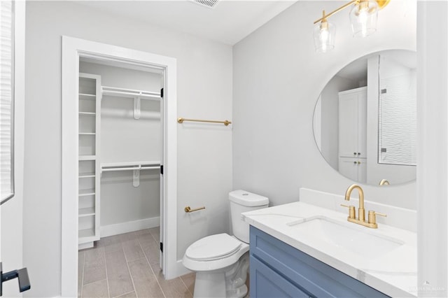 bathroom featuring hardwood / wood-style floors, vanity, and toilet