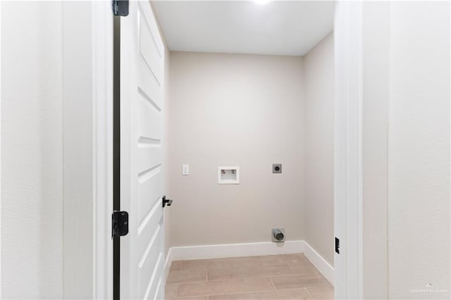 washroom featuring washer hookup, light wood-type flooring, and electric dryer hookup