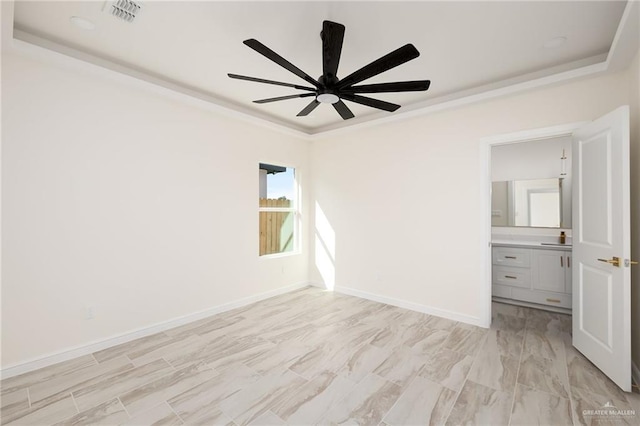 unfurnished bedroom with ensuite bath and ceiling fan