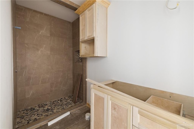 bathroom with a tile shower