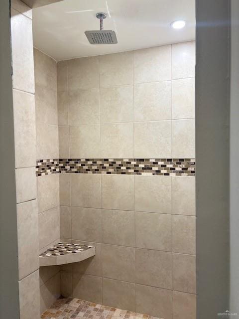 bathroom featuring tiled shower