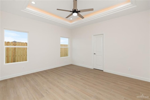 4909 Columbia Ave, Mcallen, TX 78504 - unfurnished room featuring a tray ceiling, a ceiling fan, light wood-type flooring, baseboards, and recessed lighting