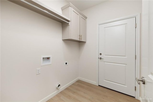 4909 Columbia Ave, Mcallen, TX 78504 - laundry room with electric dryer hookup, hookup for a washing machine, light wood-style floors, baseboards, and cabinet space