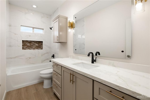 4909 Columbia Ave, Mcallen, TX 78504 - full bath with vanity, toilet, washtub / shower combination, and wood finished floors