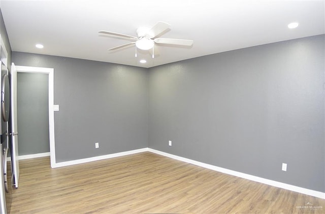 empty room with light wood-type flooring and ceiling fan