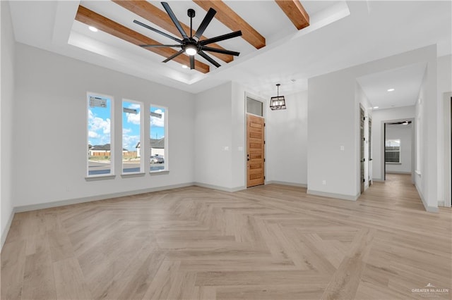 empty room with recessed lighting, baseboards, a tray ceiling, and ceiling fan with notable chandelier