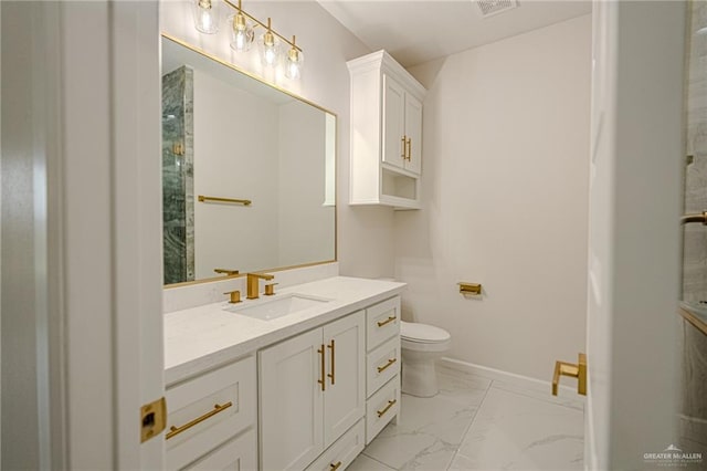 bathroom with vanity and toilet