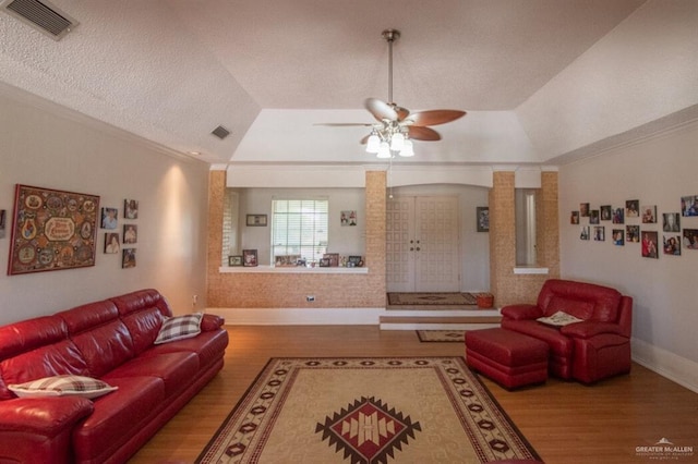 2517 E Mile 4th Rd, Mission, TX 78573 - living room with wood finished floors, ornamental molding, a tray ceiling, a ceiling fan, and baseboards