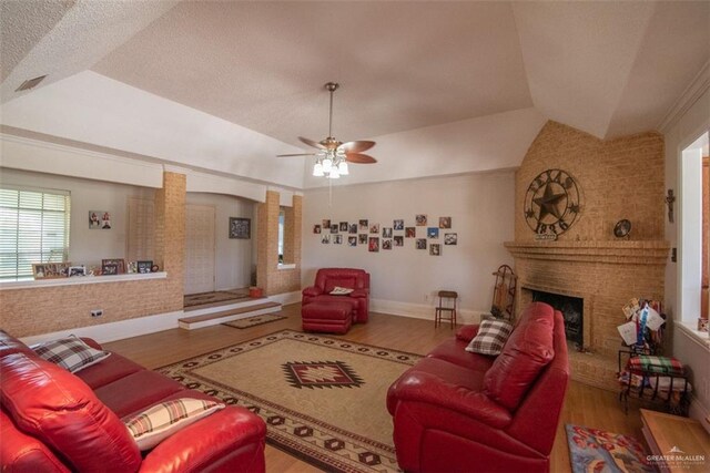 2517 E Mile 4th Rd, Mission, TX 78573 - living room with wood finished floors, ceiling fan, a brick fireplace, and lofted ceiling