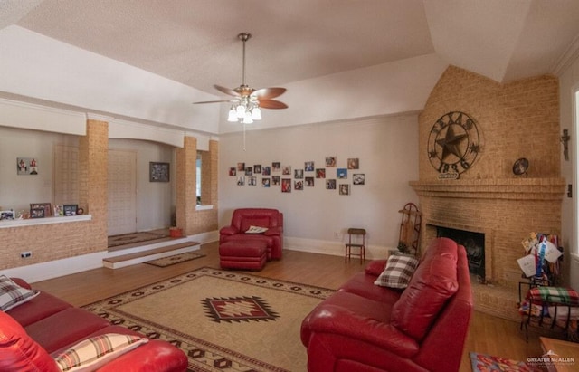 2517 E Mile 4th Rd, Mission, TX 78573 - living area featuring wood finished floors, a fireplace, vaulted ceiling, and a ceiling fan