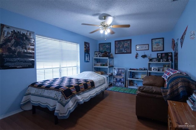 2517 E Mile 4th Rd, Mission, TX 78573 - bedroom featuring wood finished floors, a textured ceiling, and ceiling fan