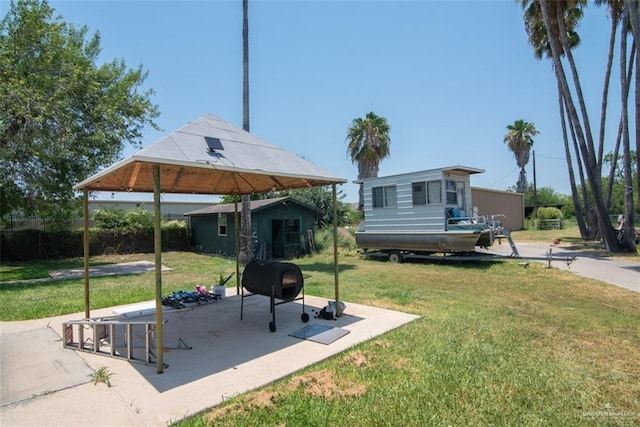 2517 E Mile 4th Rd, Mission, TX 78573 - view of green lawn featuring an outbuilding