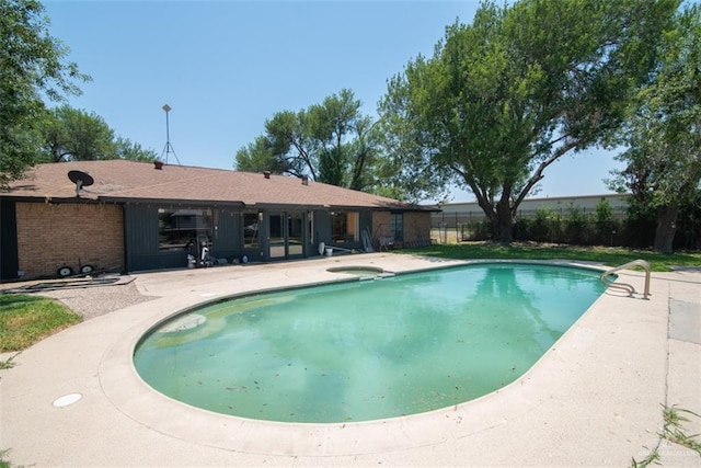 2517 E Mile 4th Rd, Mission, TX 78573 - view of swimming pool featuring a patio, fence, and a pool with connected hot tub