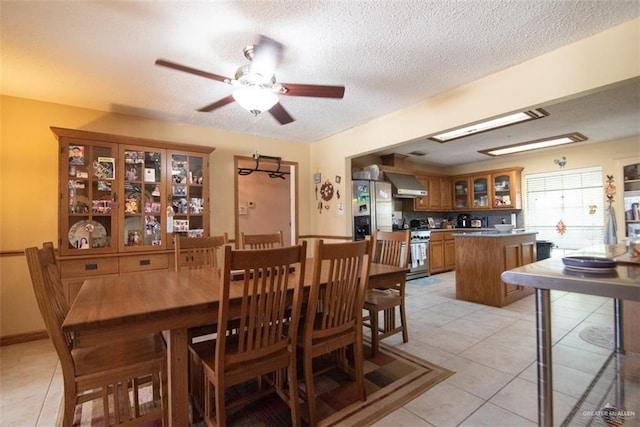 2517 E Mile 4th Rd, Mission, TX 78573 - dining area featuring light tile patterned flooring, ceiling fan, and a textured ceiling