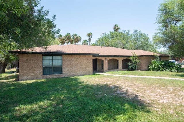 2517 E Mile 4th Rd, Mission, TX 78573 - ranch-style home featuring a front lawn