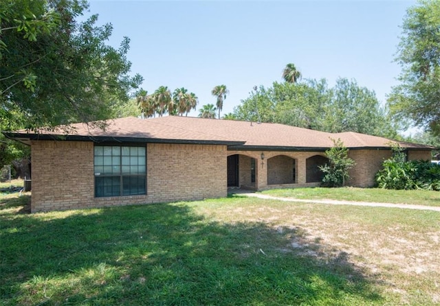 2517 E Mile 4th Rd, Mission, TX 78573 - single story home with a front lawn and brick siding