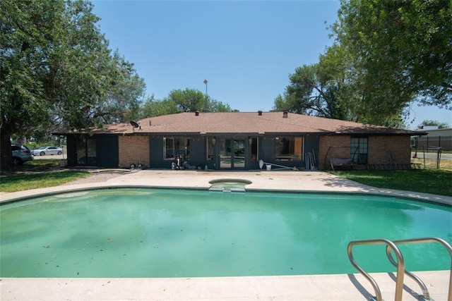 2517 E Mile 4th Rd, Mission, TX 78573 - view of swimming pool with a patio, fence, and a pool with connected hot tub