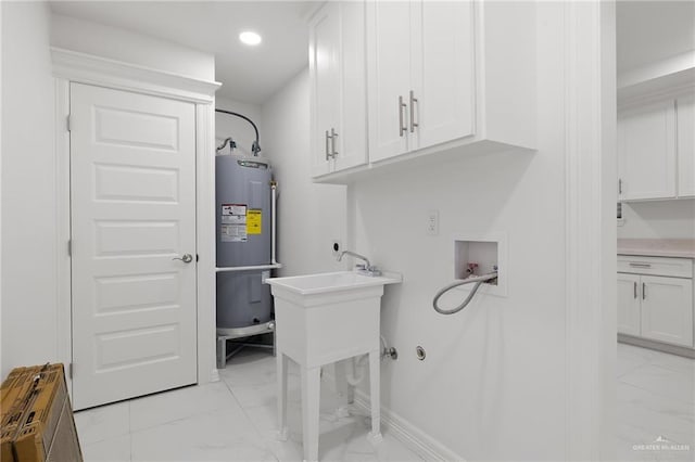 laundry room with cabinets, washer hookup, hookup for an electric dryer, and water heater