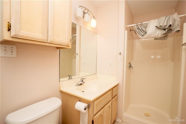 bathroom with vanity, a shower with curtain, and toilet