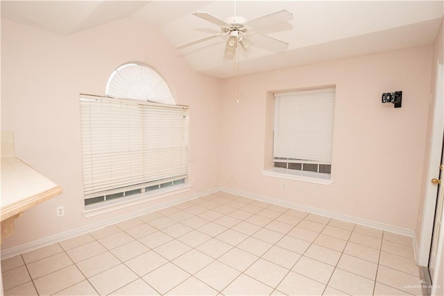 spare room featuring lofted ceiling and ceiling fan