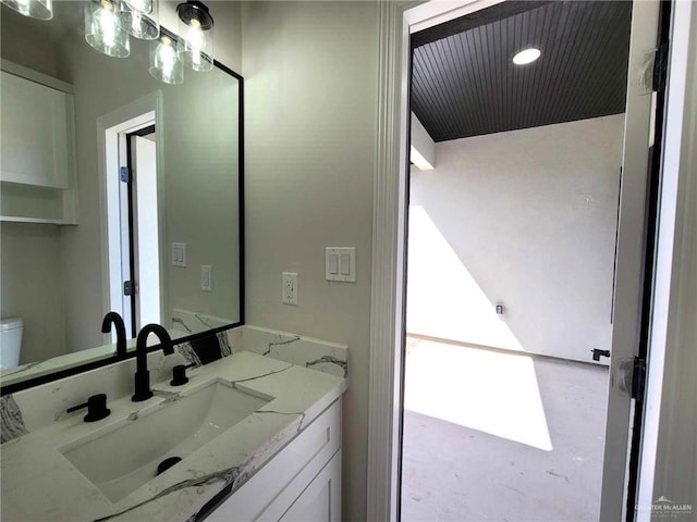 bathroom with vanity and toilet