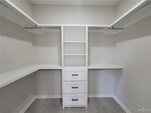 walk in closet featuring light tile patterned floors