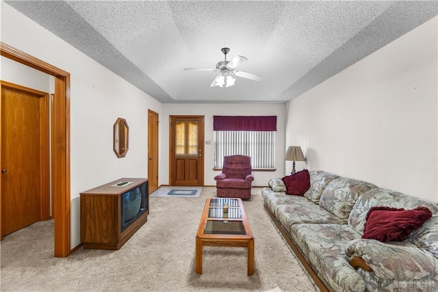 1923 Stadler Dr, Mission, TX 78572 - living room with light carpet, ceiling fan, and a textured ceiling