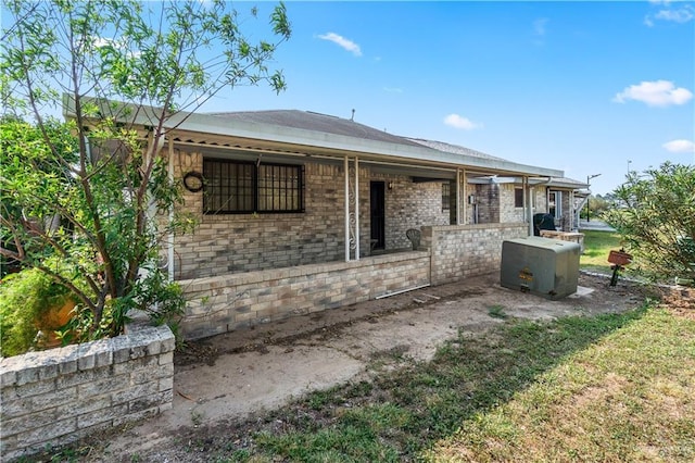 1923 Stadler Dr, Mission, TX 78572 - rear view of house featuring brick siding