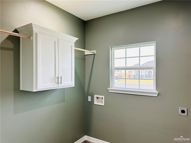 washroom featuring hookup for a washing machine, cabinet space, and hookup for an electric dryer